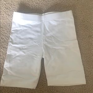 White pants and tank top